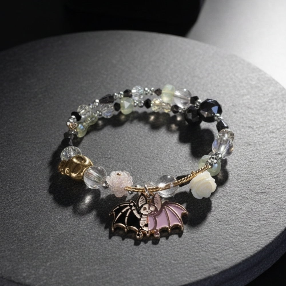 Charming Bat Bracelet with Gold and Pink Accents